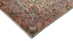 Backside of handmade 1920s Kerman rug showing knot structure and weave density