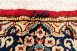 Close-up detail of 1990s Kerman rug from Iran / Persia showing Wool weave