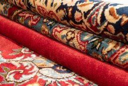 Surface texture of 1990s Kerman rug with natural Wool and intricate pattern