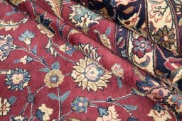 Full view of 1960s Mashad rug from Iran / Persia, 383 × 295 cm in Red tones