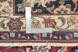 Corner detail of 1960s Mashad rug showing border pattern and Wool pile
