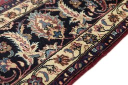 Close-up detail of 1960s Mashad rug from Iran / Persia showing Wool weave