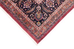 Backside of handmade 1960s Mashad rug showing knot structure and weave density