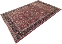 Corner detail of 1960s Mashad rug showing border pattern and Wool pile