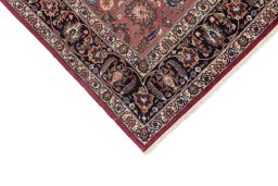 Backside of handmade 1960s Mashad rug showing knot structure and weave density