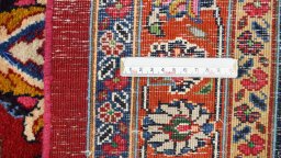 Corner detail of 1960s Mashad rug showing border pattern and Wool pile