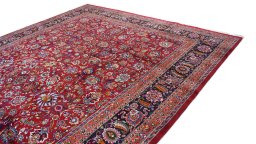 Surface texture of 1960s Mashad rug with natural Wool and intricate pattern