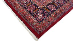Backside of handmade 1960s Mashad rug showing knot structure and weave density
