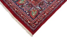 Backside of handmade 1960s Mashad rug showing knot structure and weave density