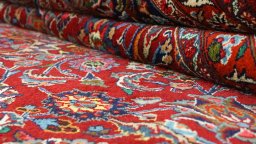 Close-up detail of 1960s Mashad rug from Iran / Persia showing Wool weave