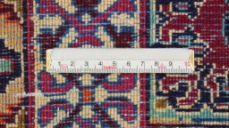 Corner detail of 1960s Mashad rug showing border pattern and Wool pile