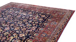 Surface texture of 1960s Mashad rug with natural Wool and intricate pattern