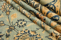 Corner detail of 1980s Mashad rug showing border pattern and Wool pile
