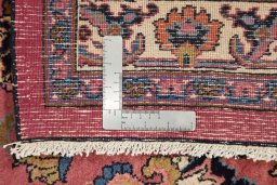 Full view of 1960s Mashad rug from Iran / Persia, 406 × 307 cm in Red tones