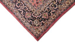 Backside of handmade 1960s Mashad rug showing knot structure and weave density