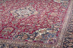 Surface texture of 1970s Mashad rug with natural Wool and intricate pattern