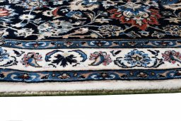 Close-up detail of New Mashad rug from Iran / Persia showing Wool weave