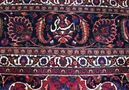Corner detail of 1950s Mashad rug showing border pattern and Wool pile