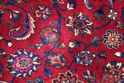 Close-up detail of 1950s Mashad rug from Iran / Persia showing Wool weave
