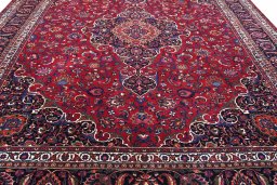 Surface texture of 1950s Mashad rug with natural Wool and intricate pattern