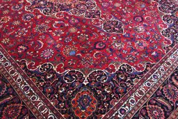 Backside of handmade 1950s Mashad rug showing knot structure and weave density