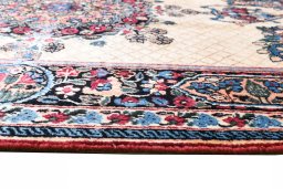 Backside of handmade 1950s Mashad rug showing knot structure and weave density