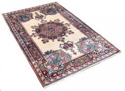Corner detail of 1950s Mashad rug showing border pattern and Wool pile