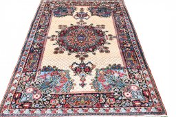 Surface texture of 1950s Mashad rug with natural Wool and intricate pattern