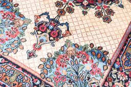 Backside of handmade 1950s Mashad rug showing knot structure and weave density