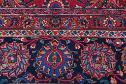 Corner detail of 1950s Mashad rug showing border pattern and Wool pile