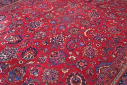 Surface texture of 1950s Mashad rug with natural Wool and intricate pattern