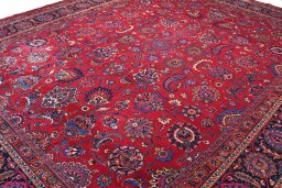 Backside of handmade 1950s Mashad rug showing knot structure and weave density
