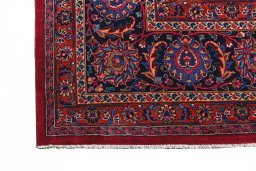 Full view of 1950s Mashad rug from Iran / Persia, 465 × 370 cm in Red tones