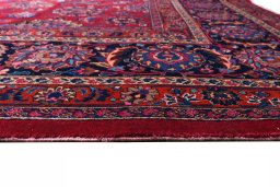 Corner detail of 1950s Mashad rug showing border pattern and Wool pile