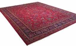 Corner detail of 1950s Mashad rug showing border pattern and Wool pile