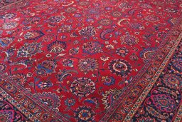 Backside of handmade 1950s Mashad rug showing knot structure and weave density