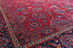 Full view of 1950s Mashad rug from Iran / Persia, 465 × 370 cm in Red tones