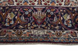 Corner detail of 1970s Mashad rug showing border pattern and Wool pile