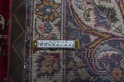 Backside of handmade 1970s Mashad rug showing knot structure and weave density