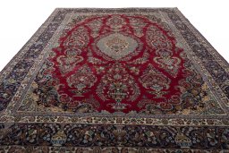 Surface texture of 1970s Mashad rug with natural Wool and intricate pattern