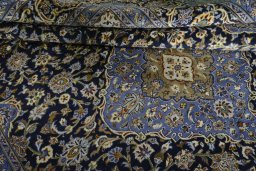 Close-up detail of 2000s Mashad rug from Iran / Persia showing Wool weave