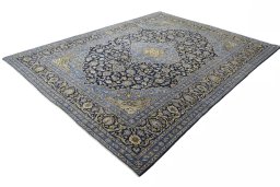 Corner detail of 2000s Mashad rug showing border pattern and Wool pile