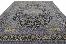 Surface texture of 2000s Mashad rug with natural Wool and intricate pattern