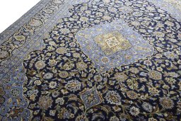 Backside of handmade 2000s Mashad rug showing knot structure and weave density