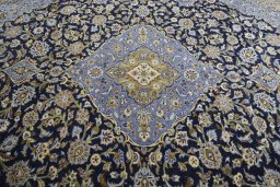 Central medallion detail of 2000s Mashad rug from Iran / Persia