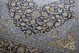 Close-up detail of 2000s Mashad rug from Iran / Persia showing Wool weave