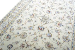 Backside of handmade New Mashad rug showing knot structure and weave density