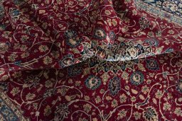 Backside of handmade 2000s Mashad rug showing knot structure and weave density