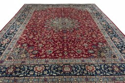 Surface texture of 2000s Mashad rug with natural Wool and intricate pattern