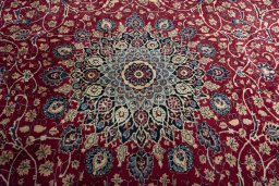 Central medallion detail of 2000s Mashad rug from Iran / Persia